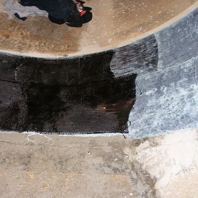 Irregular joint between a pipe and tunnel that has been restored with HydraWrap