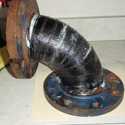 An elbow pipe that has been wrapped with HydraWrap to protect and strengthen it