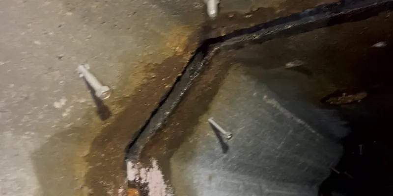 A joint in a box-culvert with anchors drilled on either side of the joint