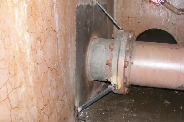 Bulkhead penetration point that has been ground clean, in preparation for a HydraWrap application