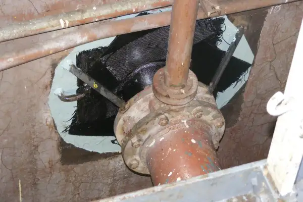 Bulkhead penetration point that has been reinforced with HydraWrap, the structurally composite repair system