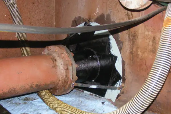 Bulkhead penetration point that has been reinforced with HydraWrap, the structurally composite repair system