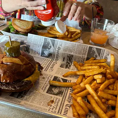 A burger and fries on a table