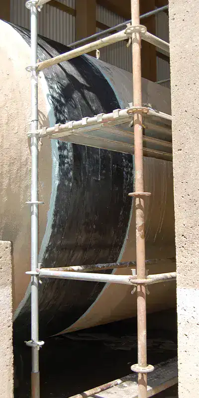 HydraWrap reinforcing the exterior of a joint in a. large cooling water pipe