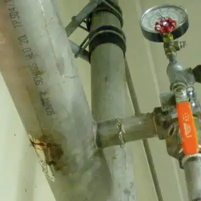 Old compromised pipe with a leak