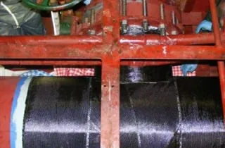 A portion of a cooling water supply pipeline that has been wrapped in HydraWrap
