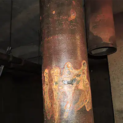An old severely corroded pipe
