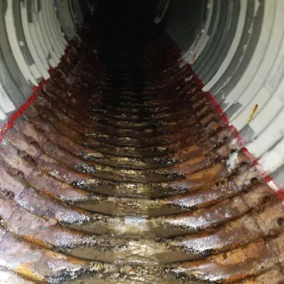 A corrugated metal pipe that has a deteriorated invert.