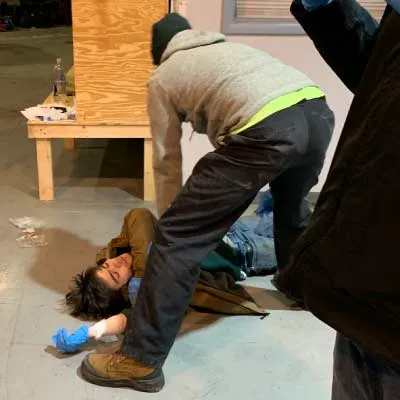 Two people practicing emergency responses