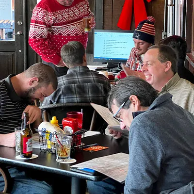 Several employees sitting at the Christmas lunch