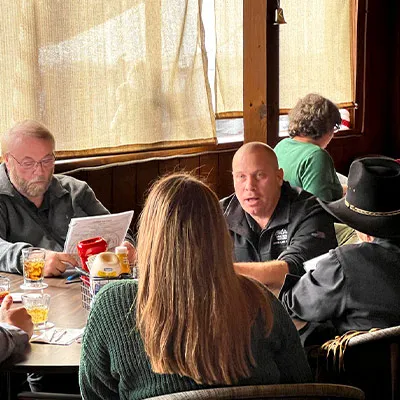 Several employees sitting at the Christmas lunch