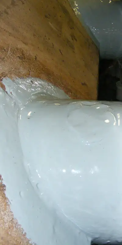 A portion of a cast-iron pipe coated in epoxy