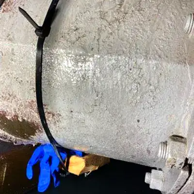 A temporary repair applied to a leaking steel pipe