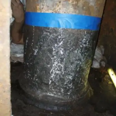 A portion of a heavy fuel oil line that has had its surface ground clean