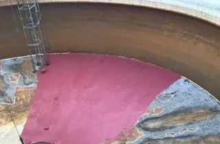 A storm drain retention tank being coated in epoxy