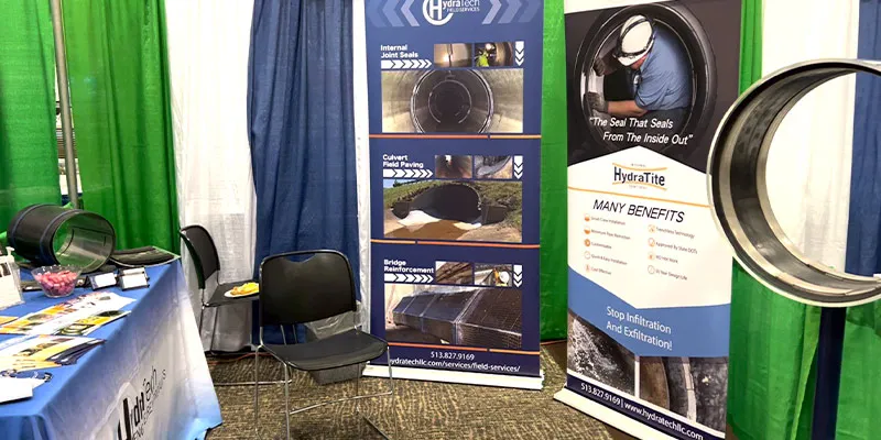 HydraTech Engineered Products booth at The Ohio Stormwater Conference. The booth has banners and promotional materials