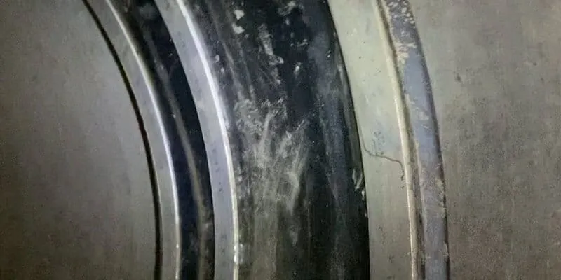HydraTite installed over a joint in a concrete pipe. Three stainless steel retaining bands locking the rubber in place.