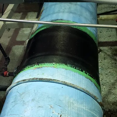 A portion of a FRP pipe wrapped in HydraWrap to restore the pipe