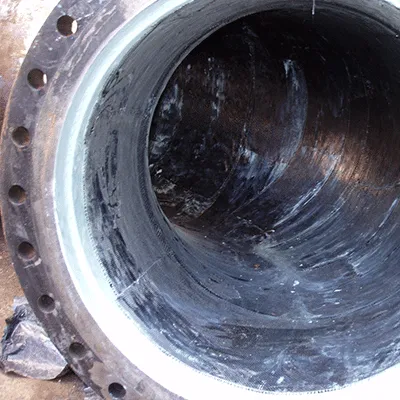 Inside view of a cooling water pipeline at a power plant. The interior has been wrapped in HydraWrap to repair the portions that had developed through wall leaks