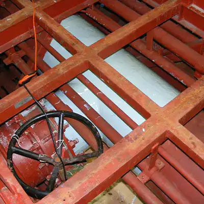 A tee fitting in a water cooling system that has been coated in epoxy