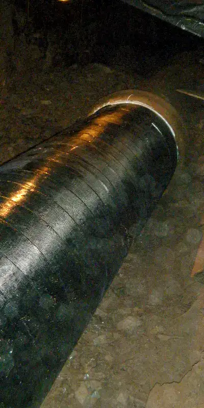 A portion of a cast iron pipe that has been restored with HydraWrap