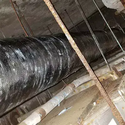 A gas main that has been fortified with HydraWrap
