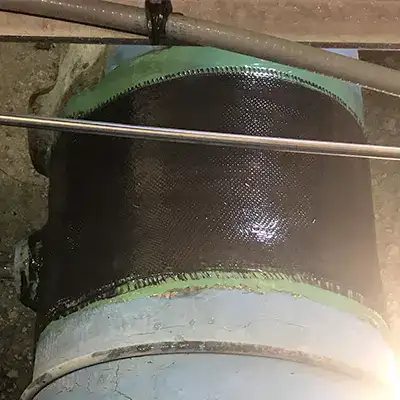 A portion of a FRP pipe wrapped in HydraWrap to restore the pipe