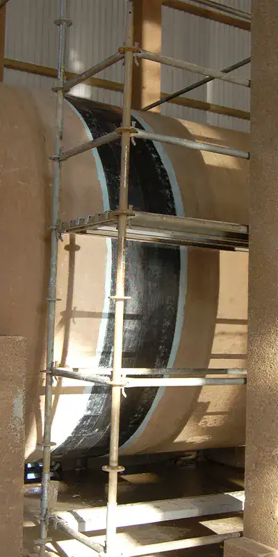 HydraWrap reinforcing the exterior of a joint in a. large cooling water pipe