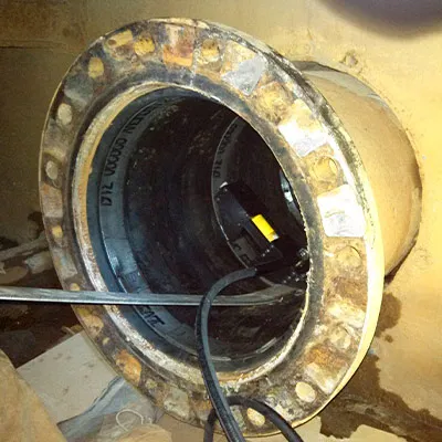 HydraTite being installed with a hydraulic expander over a liner at the end of a pipe