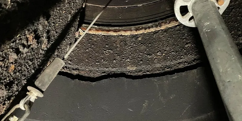 An inside view of a riser that has signs of aging