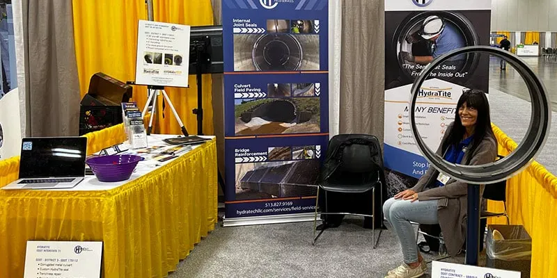The HydraTech booth at a tradeshow full of promotional material