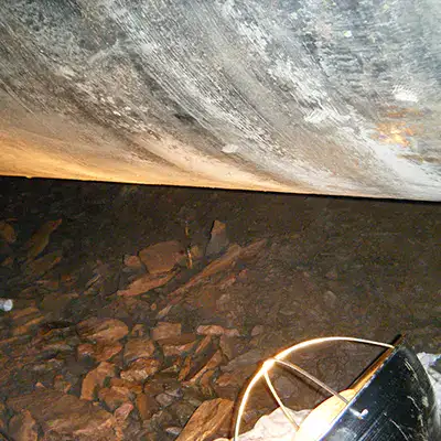 An old cast iron supply line with visible corrosion