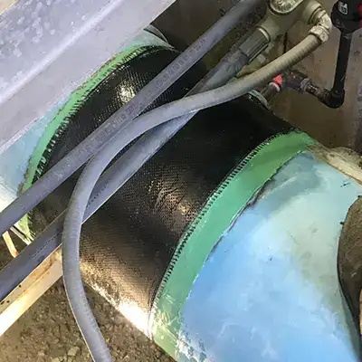 A portion of a FRP pipe wrapped in HydraWrap to restore the pipe