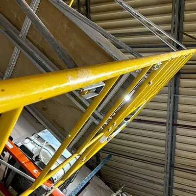 Yellow scaffolding set up in the Field Services work area