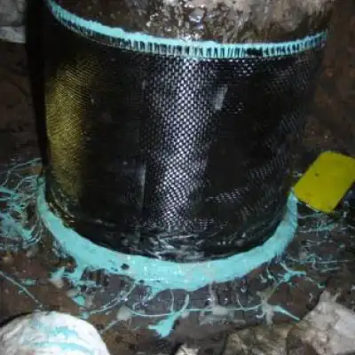 A portion of a heavy fuel oil line that has been wrapped in carbon fiber fabric, HydraWrap