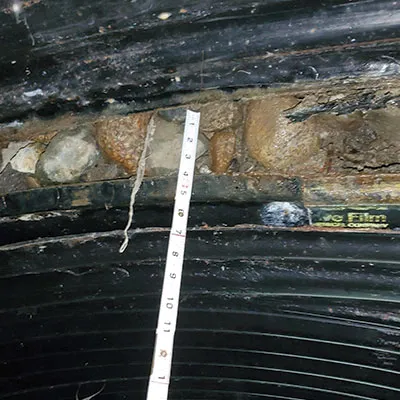 Inspecting a separated joint in a corrugated metal pipe