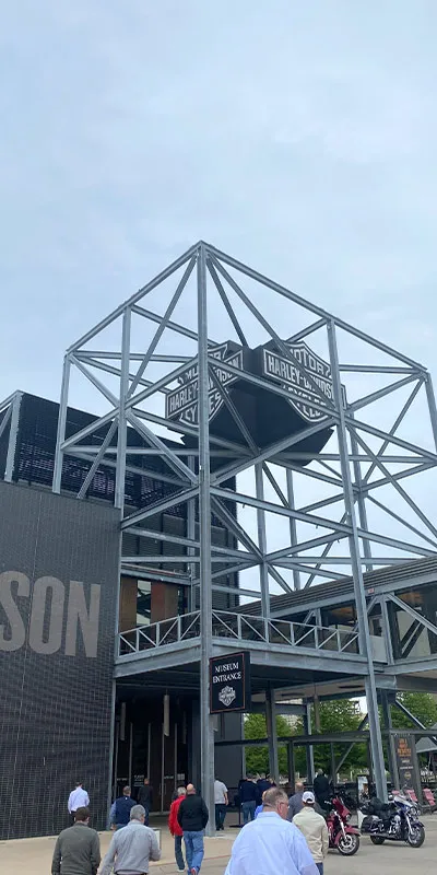 A large display holding up a Harley-Davidson sign