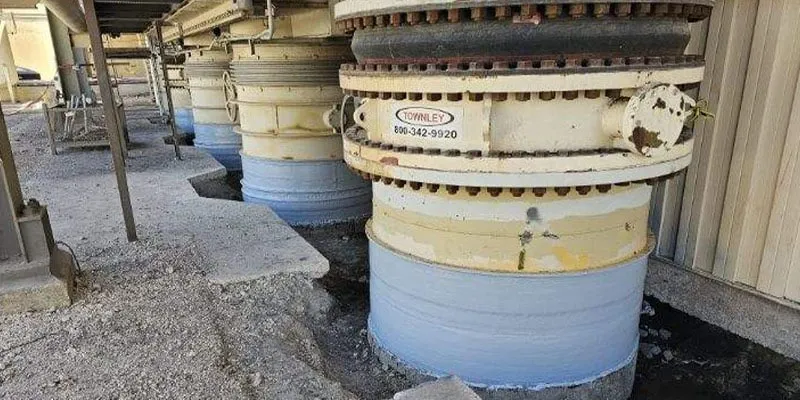 Old risers that have been repaired with carbon fiber fabric composite system and epoxy topcoat