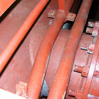 An old tee fitting in a water cooling system onboard a vessel