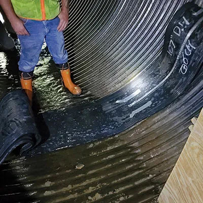 Positioning the rubber of a HydraTite seal over a joint
