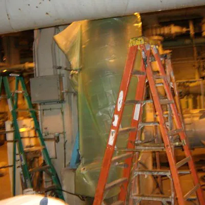 A reducing elbow wrapped in plastic