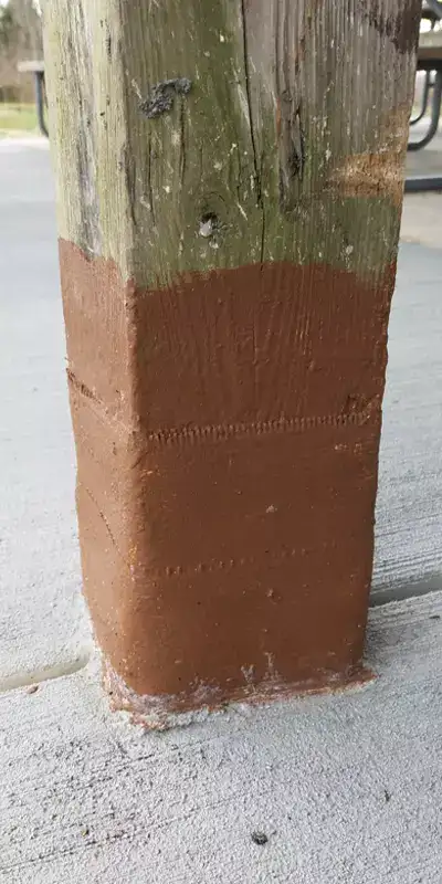 A wooden post that has been wrapped in HydraWrap