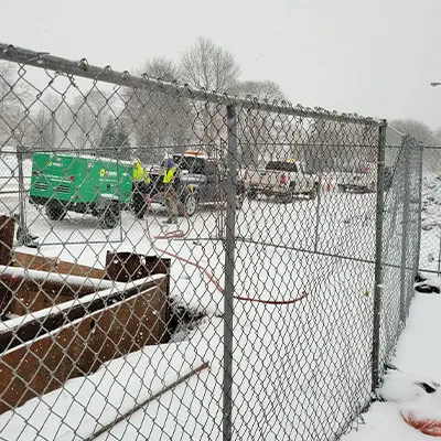 Snow covering the ground at this construction site