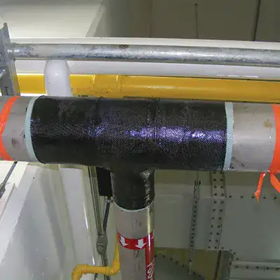 A tee fitting pipe wrapped in HydraWrap to restore this portion of pipe