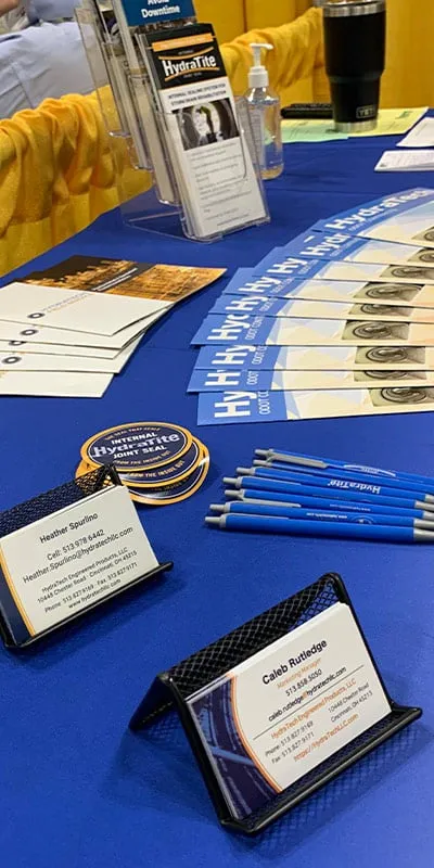 Promotional materials on a trade booth table for HydraTech