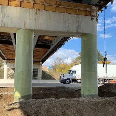 Two columns wrapped in a composite repair system of resin and fabric