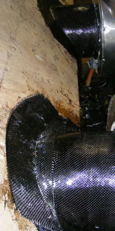 A portion of two cast-iron pipes restored with HydraWrap