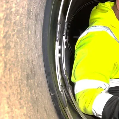 Stainless steel retaining bands positioned over the rubber of a HydraTite seal