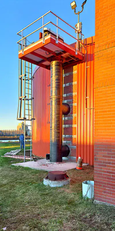 HydraWrap applied to a vertical digester mixing pipe to fortifying it against corrosion