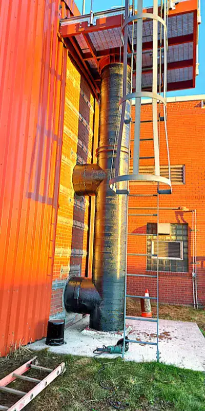 HydraWrap applied to a vertical digester mixing pipe to fortifying it against corrosion
